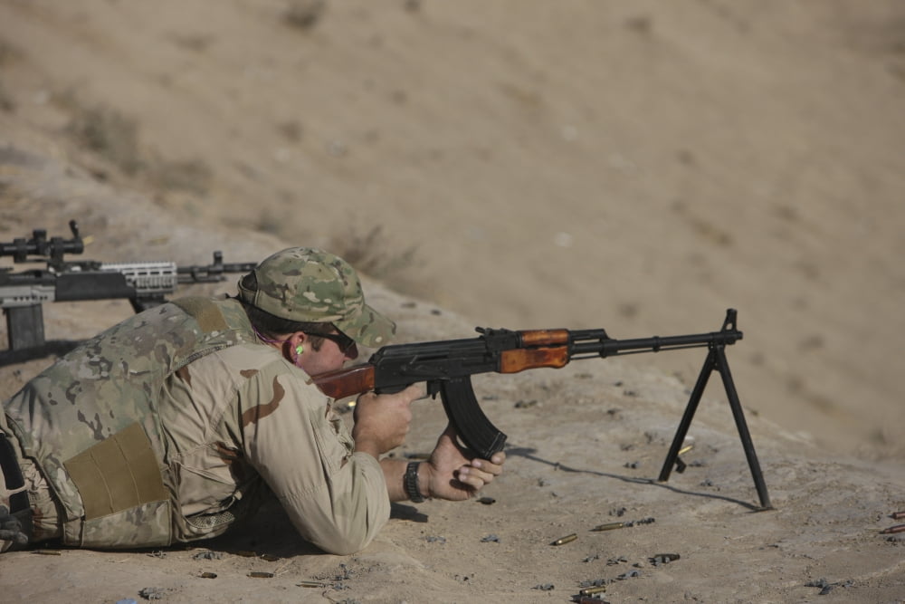 Soldier fires a Russian RPK Kalashnikov Light Machine Gun Canvas Art - Terry MooreStocktrek Images (35 x 24)