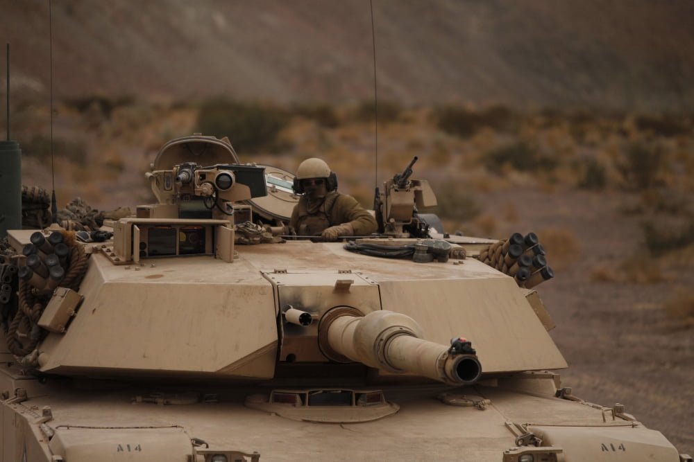 Soldier looks out the main hatch of his tank during a patrol Canvas Art - Stocktrek Images (35 x 23)