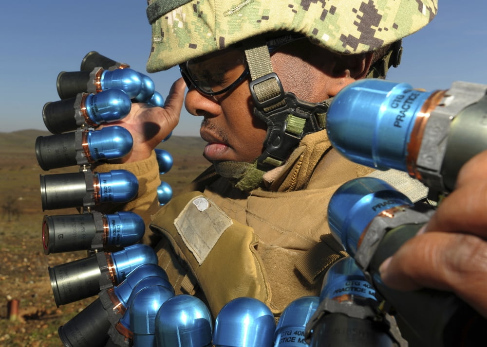 Soldier readies 40mm grenades to fire from the Mk19 grenade launcher Canvas Art - Stocktrek Images (34 x 24)