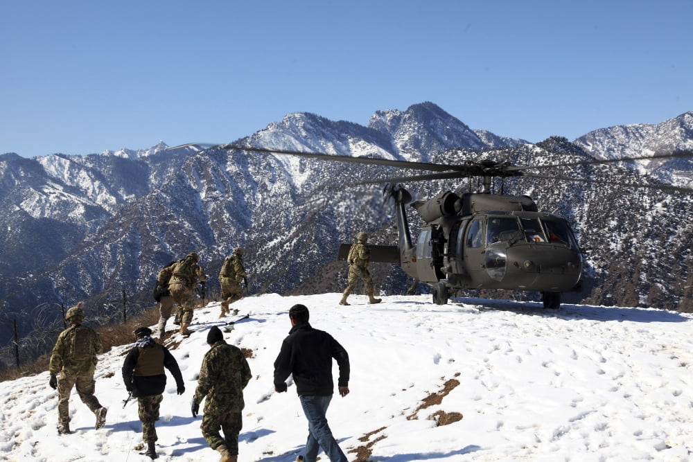 Soldiers board a US Army UH-60 Black Hawk helicopter Afghanistan Canvas Art - Stocktrek Images (35 x 23)