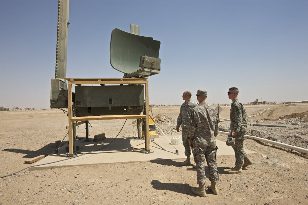 Soldiers checking a radar system at a military base in Iraq Canvas Art - Terry MooreStocktrek Images (18 x 12)