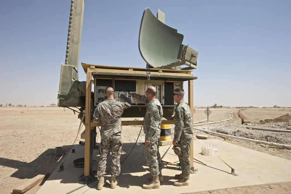 Soldiers checking a radar system at a military base in Tikrit Iraq Canvas Art - Terry MooreStocktrek Images (18 x 12)