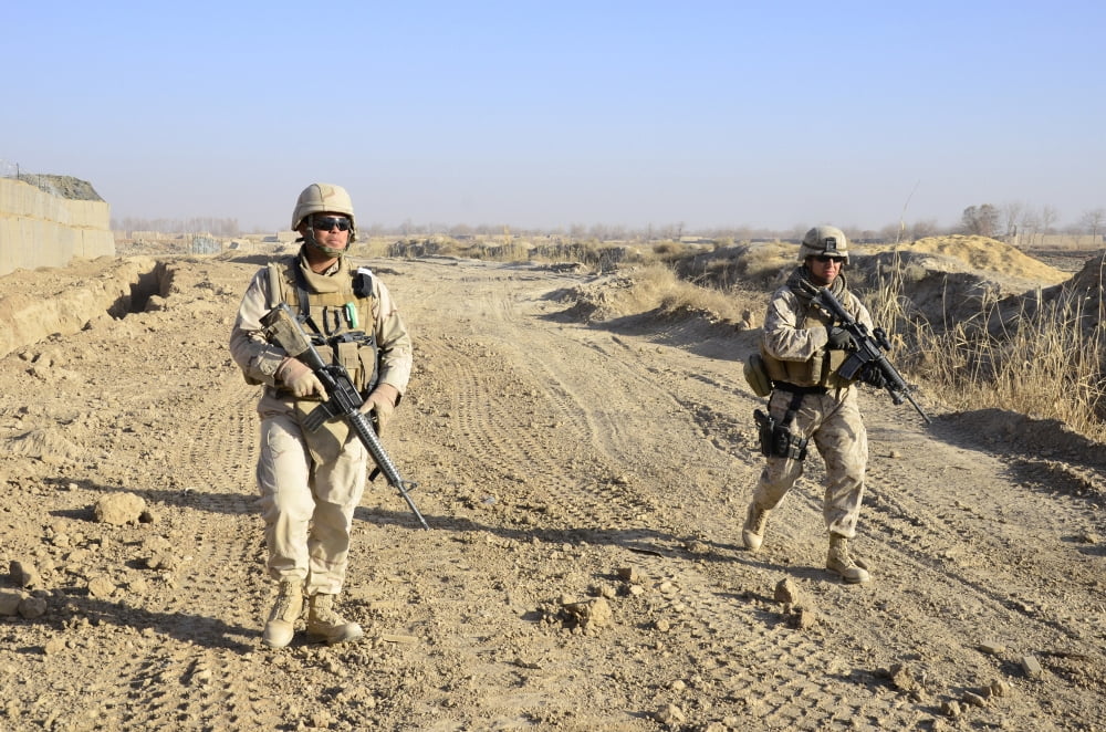 Soldiers conduct a perimeter security check around a combat outpost in Diwar Afghanistan Canvas Art - Stocktrek Images (34 x 23)