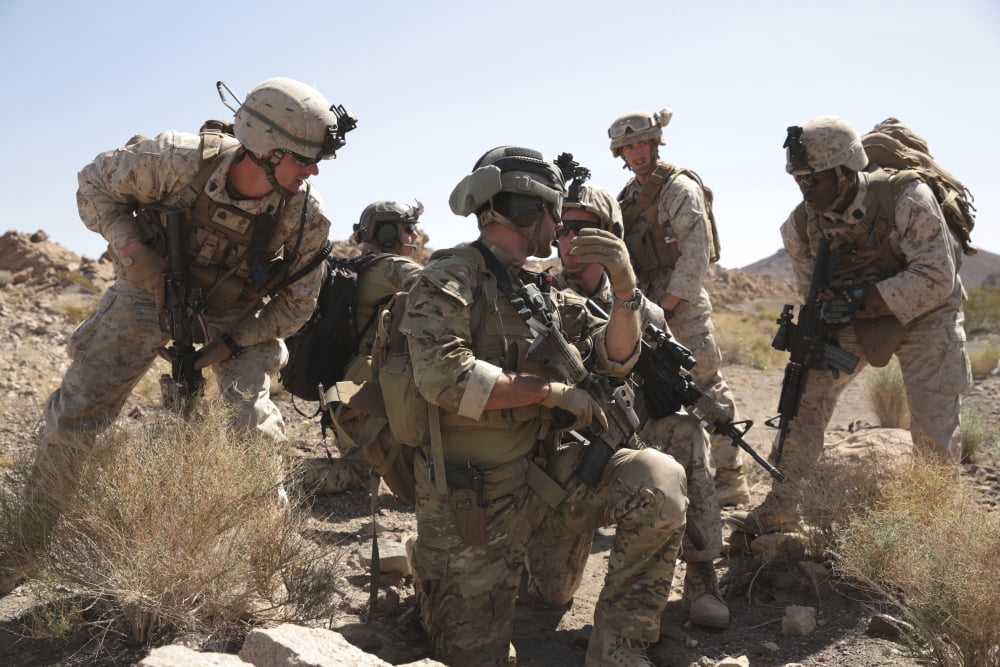 Soldiers discuss strategy during a tactical recovery exercise Canvas Art - Stocktrek Images (34 x 23)