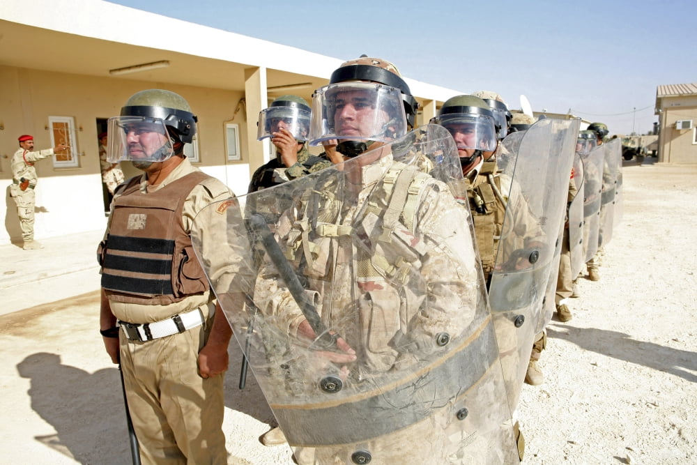 Soldiers from the 7th Iraqi Army Division stand ready during a riot control training exercise Canvas Art - Stocktrek Images (34 x 23)