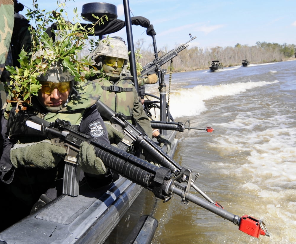 Soldiers in camouflage at the Naval Small Craft Instruction doing a field training exercise Canvas Art - Stocktrek Images (31 x 26)