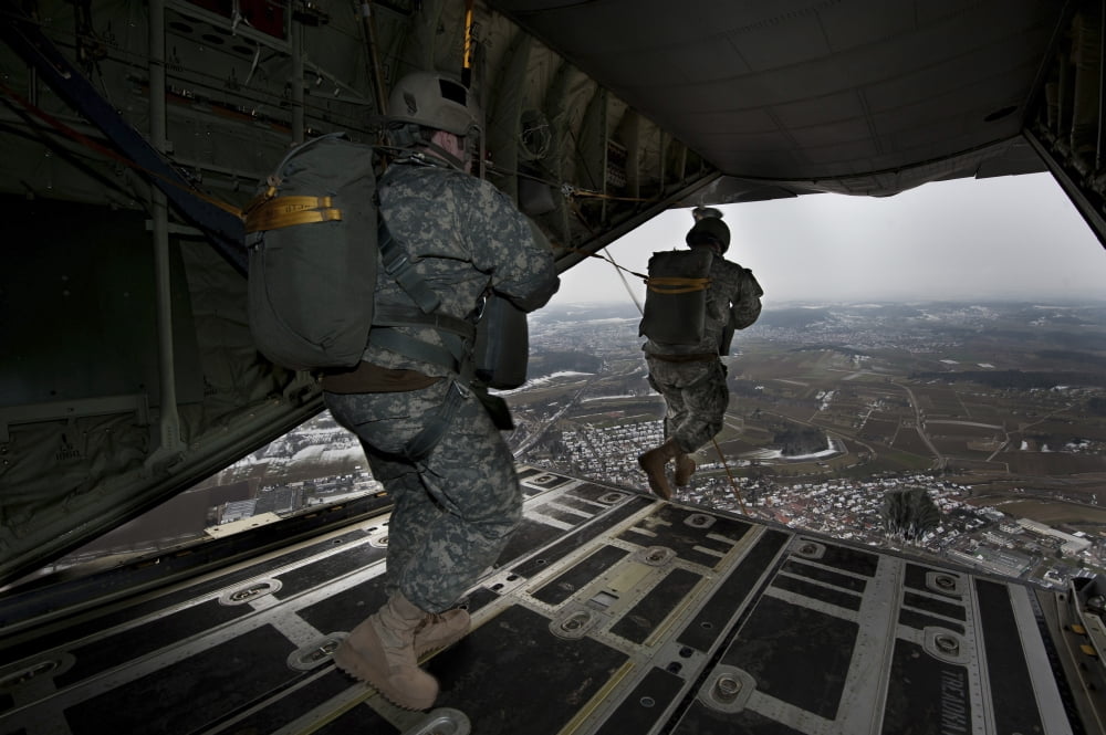 Soldiers jump from a C-130 aircraft over Germany Canvas Art - Stocktrek Images (35 x 23)