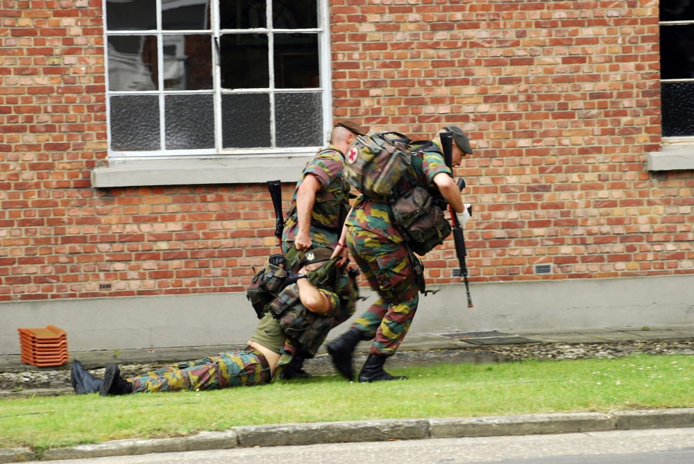 Soldiers of the Belgian Army helping and transporting a wounded mate Canvas Art - Luc De JaegerStocktrek Images (34 x 23)