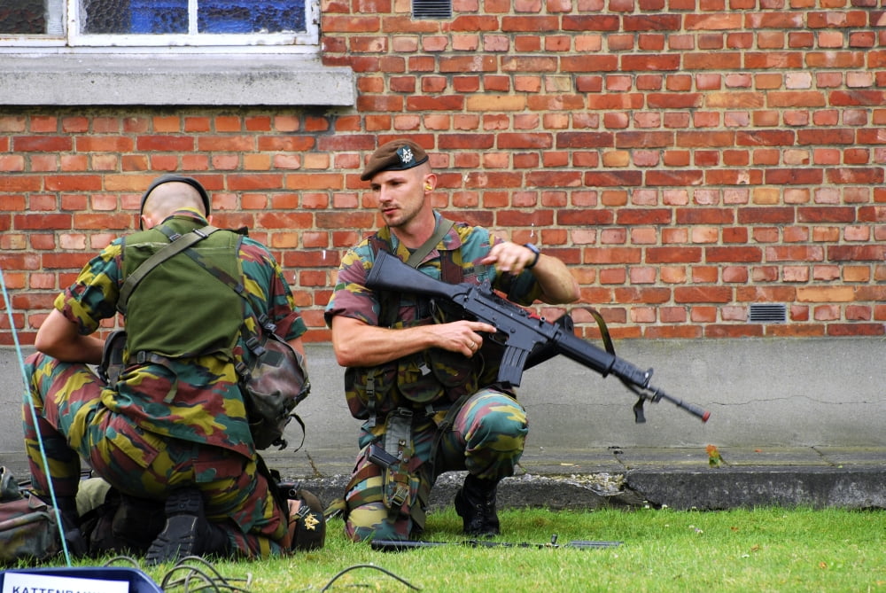 Soldiers of the Belgian Army helping and transporting a wounded mate Canvas Art - Luc De JaegerStocktrek Images (34 x 23)