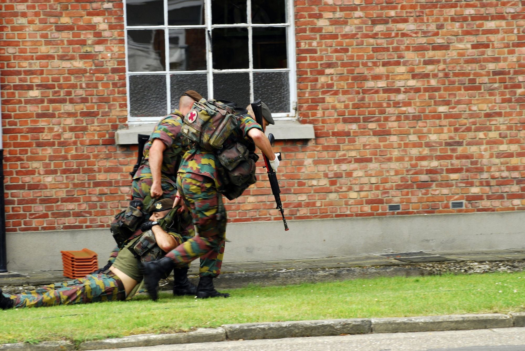 Soldiers of the Belgian Army helping and transporting a wounded mate Canvas Art - Luc De JaegerStocktrek Images (34 x 23)
