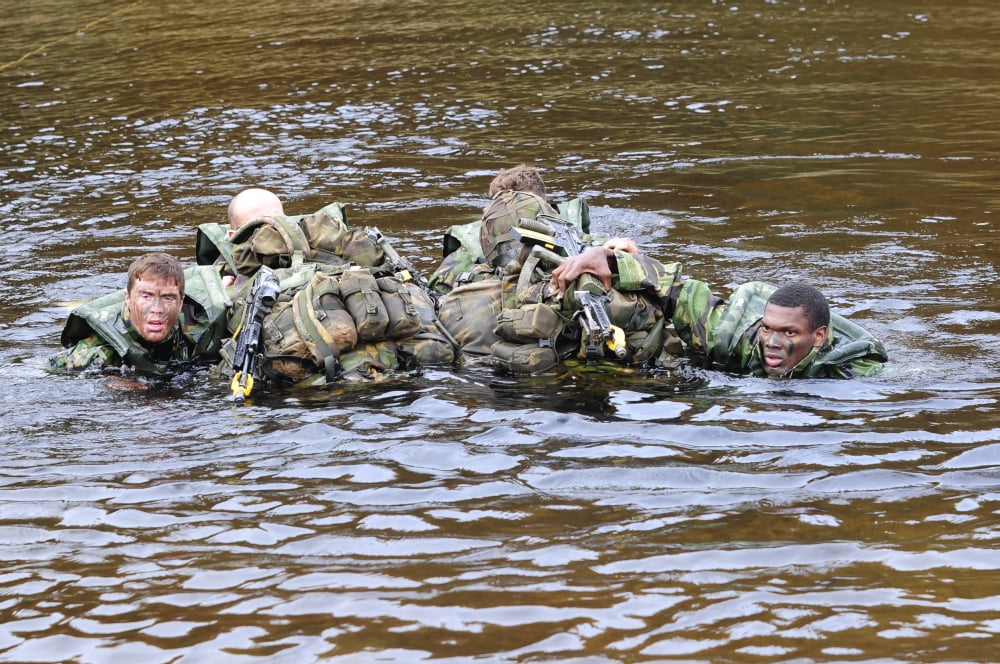 Soldiers participate in a river crossing during Exercise Cambrian Patrol Canvas Art - Andrew ChittockStocktrek Images (34 x 23)