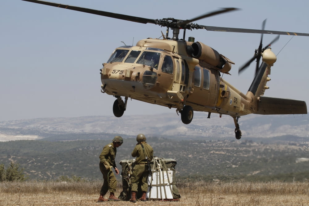 Soldiers practice external cargo mounting on a UH-60 Yanshuf of the Israel Air Force Canvas Art - Ofer ZidonStocktrek Images (34 x 23)