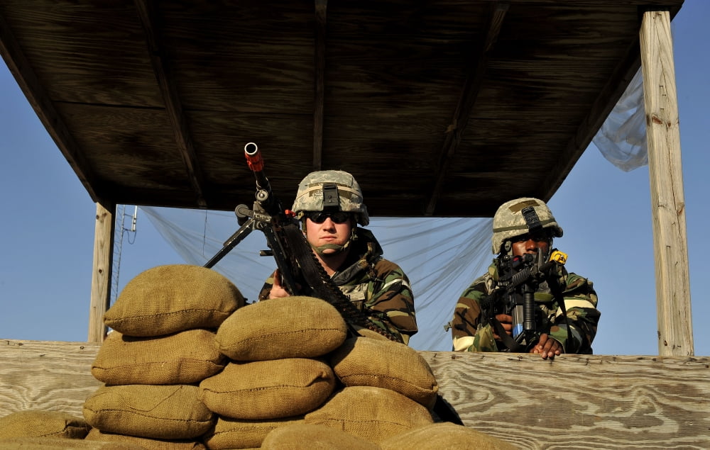 Soldiers provide security from a lookout tower Canvas Art - Stocktrek Images (35 x 23)