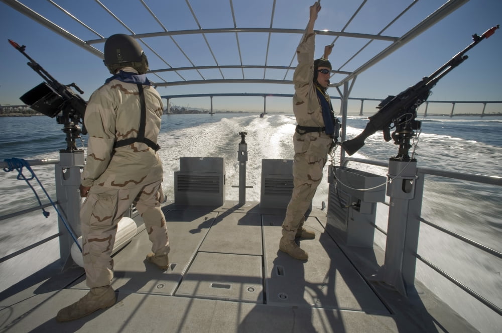 Soldiers serve as aft lookouts on a patrol boat San Diego Bay Canvas Art - Stocktrek Images (34 x 23)