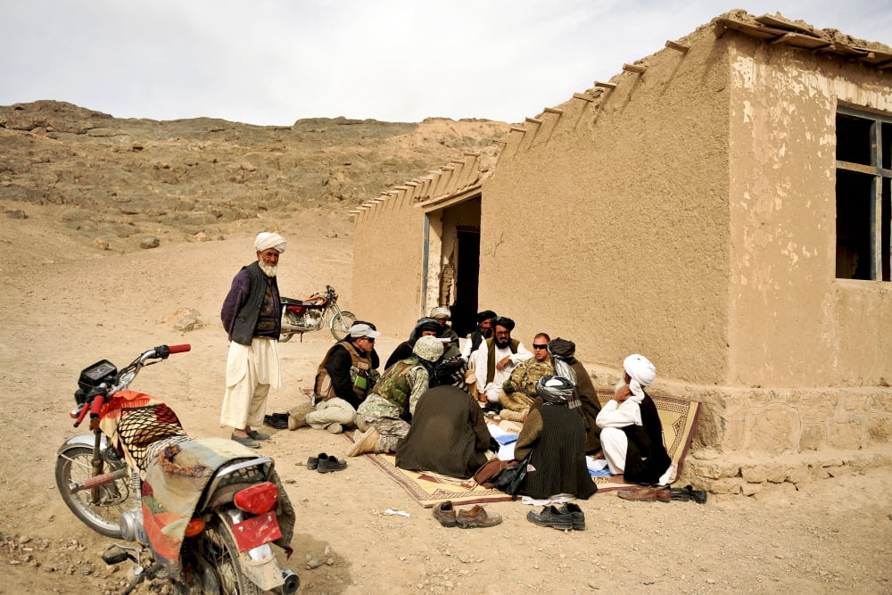 Soldiers speak with school teachers in Shah Joy Afghanistan Canvas Art - Stocktrek Images (35 x 23)