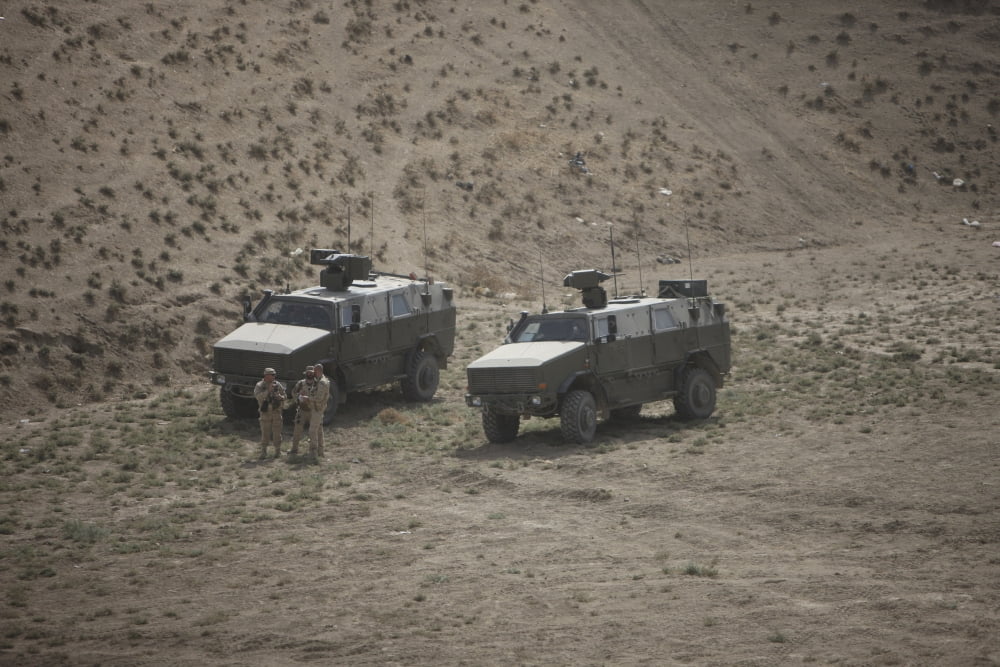 Soldiers stand outside their German ATF Dingo infantry mobility vehicles Canvas Art - Terry MooreStocktrek Images (18 x 12)