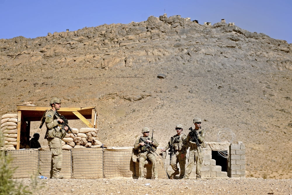 Soldiers wait for Afghan National Police members at the district center in Mizan Afghanistan Canvas Art - Stocktrek Images (35 x 23)