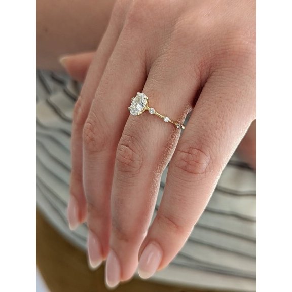 Solitaire Brilliance 1 Carat Oval Moissanite Engagement Ring with Space Pave in 10k Yellow Gold, Ring Size 6.5