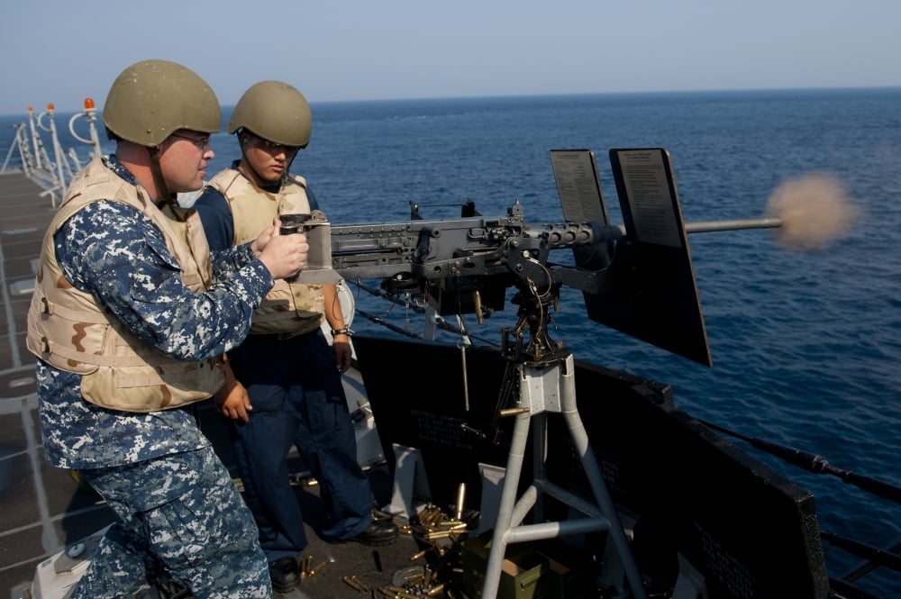 Sonar Technician fires a 50 cal machine gun aboard USS Jason Dunham Canvas Art - Stocktrek Images (35 x 23)