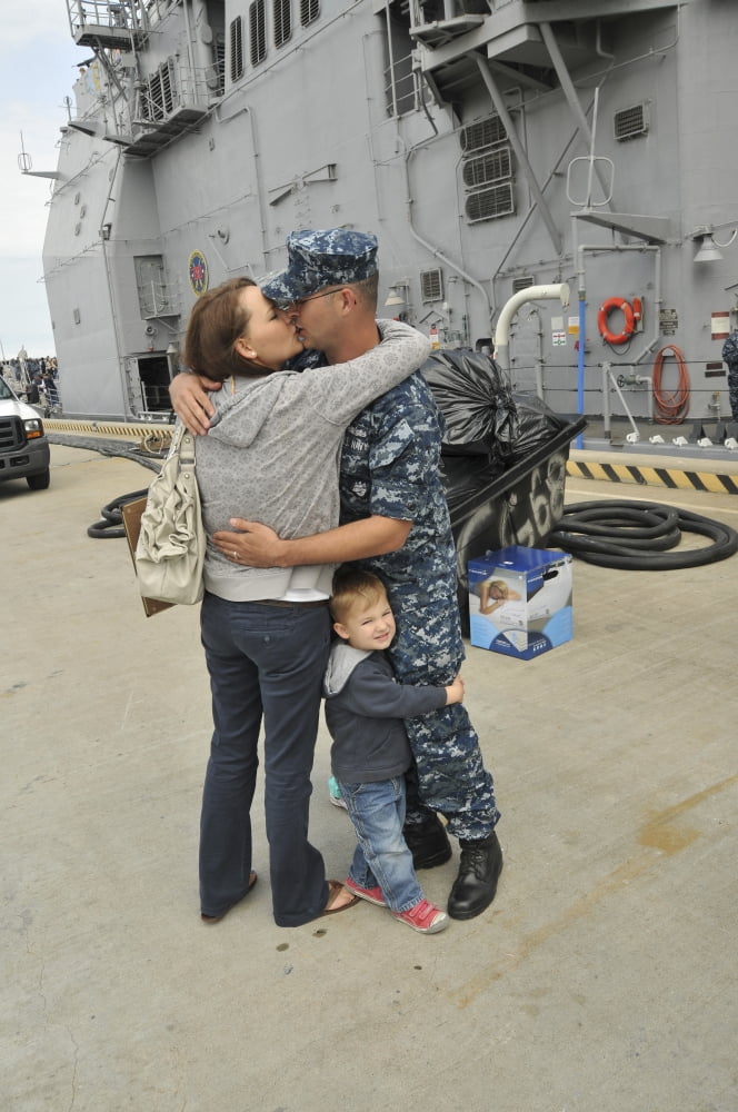 Sonar Technician kisses his wife goodbye before the ships departure Canvas Art - Stocktrek Images (23 x 35)