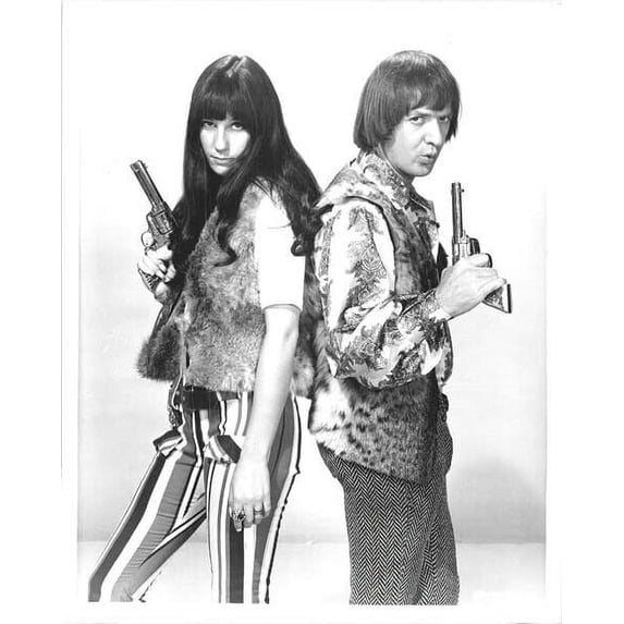 Sonny and Cher both holding guns 1968 portrait 8x10 inch photo for TV show