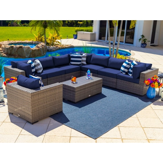 Sorrento 9-Piece Resin Wicker Outdoor Patio Furniture Sectional Sofa Set in Gray w/ Seven Sectional Seats, Armchair, and Coffee Table (Flat-Weave Gray Wicker, Sunbrella Canvas Navy)