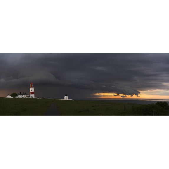 Souter Lighthouse under ominous storm clouds; South Shields, Tyne and Wear, England Poster Print by John Short / Design Pics (34 x 22)