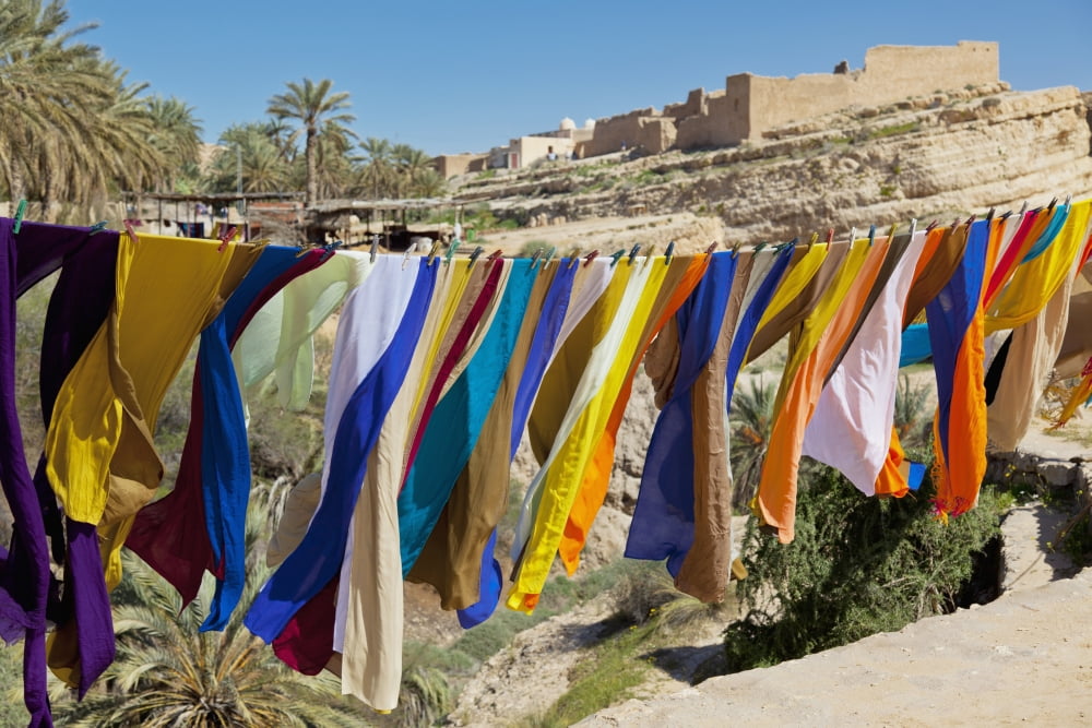 Souvenir Scarves Flap In The Breeze Above The Canyon Near The Algerian Border Mides Tunisia North Africa Canvas Art - Ron Watts Design Pics (38 x 24)