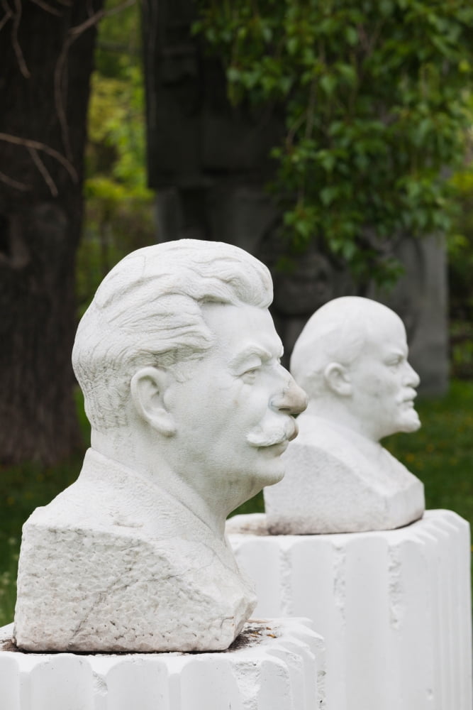 Soviet-era sculptures of Vladimir Lenin and Joseph Stalin at Art Muzeon Sculpture Park Zamoskvorechiye-Area Moscow Russia Canvas Art - Panoramic Images (36 x 12)