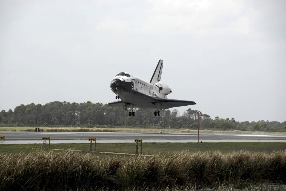 Space Shuttle Discovery approaches landing on the runway at the Kennedy Space Center Canvas Art - Stocktrek Images (34 x 23)