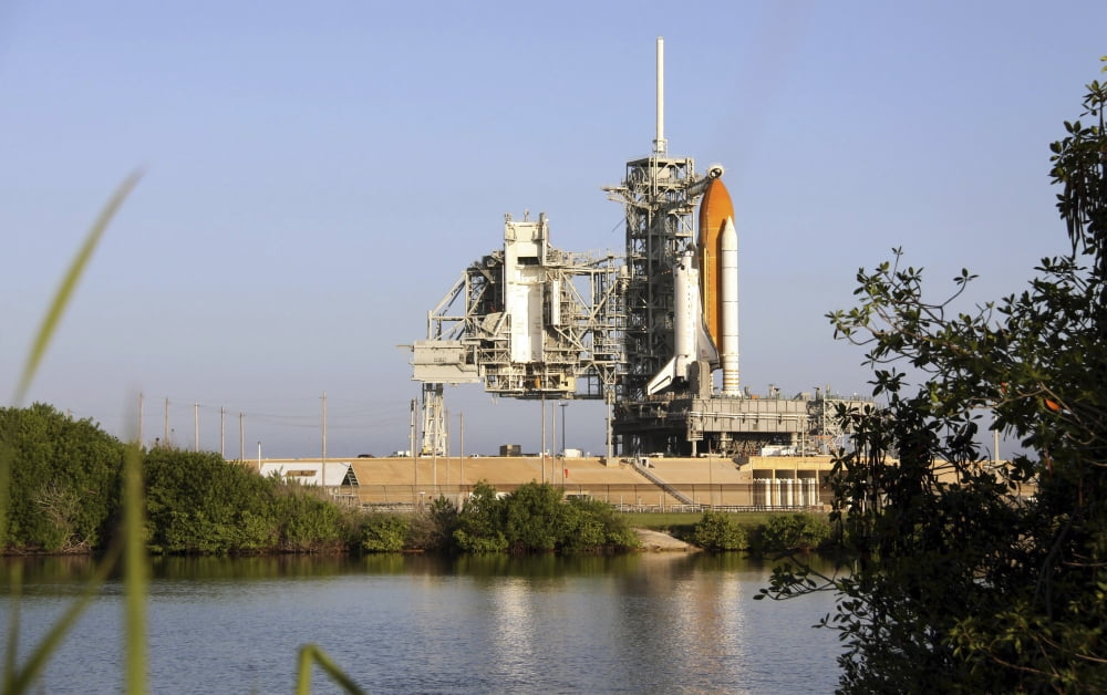 Space Shuttle Discovery sits ready on the launch pad at Kennedy Space Center Canvas Art - Stocktrek Images (35 x 22)