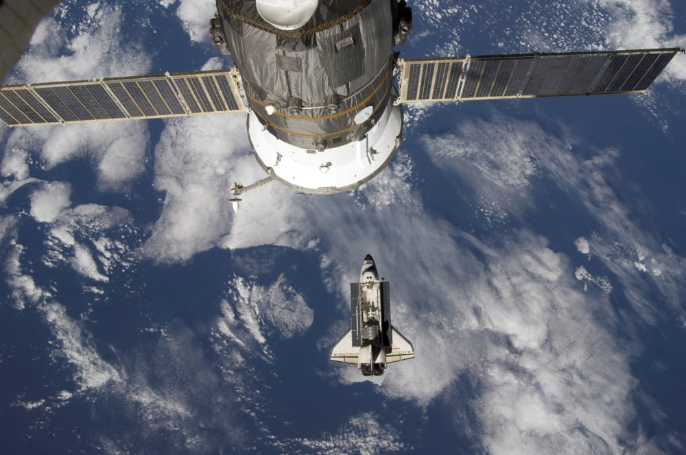 Space Shuttle Endeavour a Russian spacecraft is visible in the foreground Canvas Art - Stocktrek Images (34 x 23)