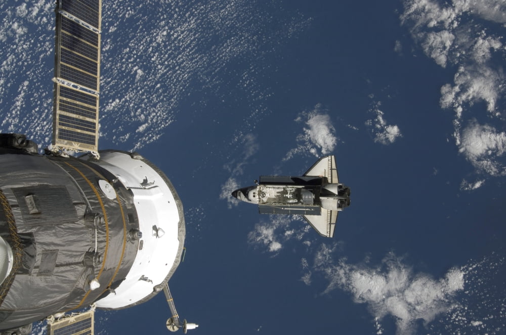 Space Shuttle Endeavour a Russian spacecraft is visible in the foreground Canvas Art - Stocktrek Images (34 x 23)