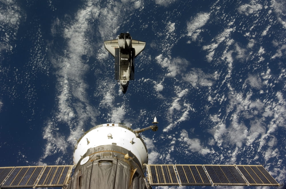 Space Shuttle Endeavour and a Soyuz spacecraft Canvas Art - Stocktrek Images (35 x 23)