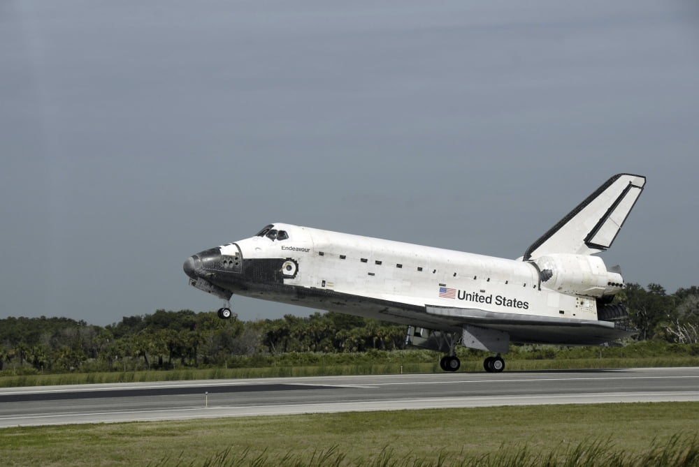 Space Shuttle Endeavour touches down on the runway at Kennedy Space Center Canvas Art - Stocktrek Images (34 x 23)