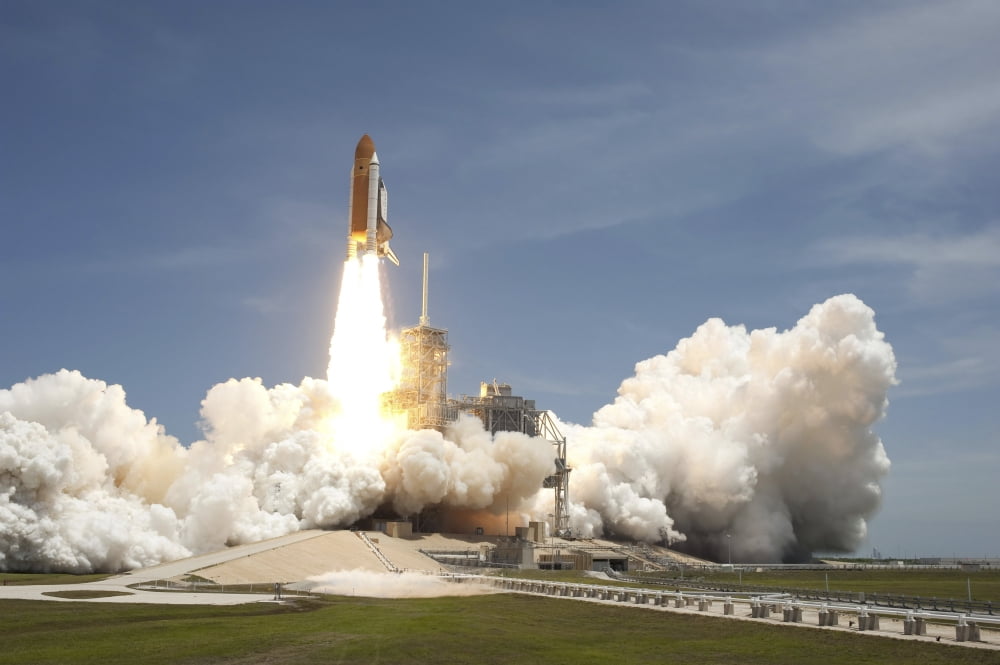 Space shuttle Atlantis rumbles the Space Coast as it lifts off from Kennedy Space Centers Launch Pad 39A Canvas Art - Stocktrek Images (34 x 23)