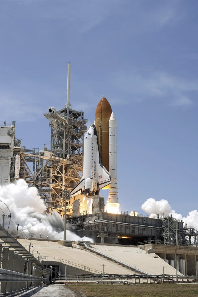 Space shuttle Atlantis twin solid rocket boosters ignite to propel the spacecraft off Kennedy Space Centers Launch Pad 39A Canvas Art - Stocktrek Images (23 x 34)