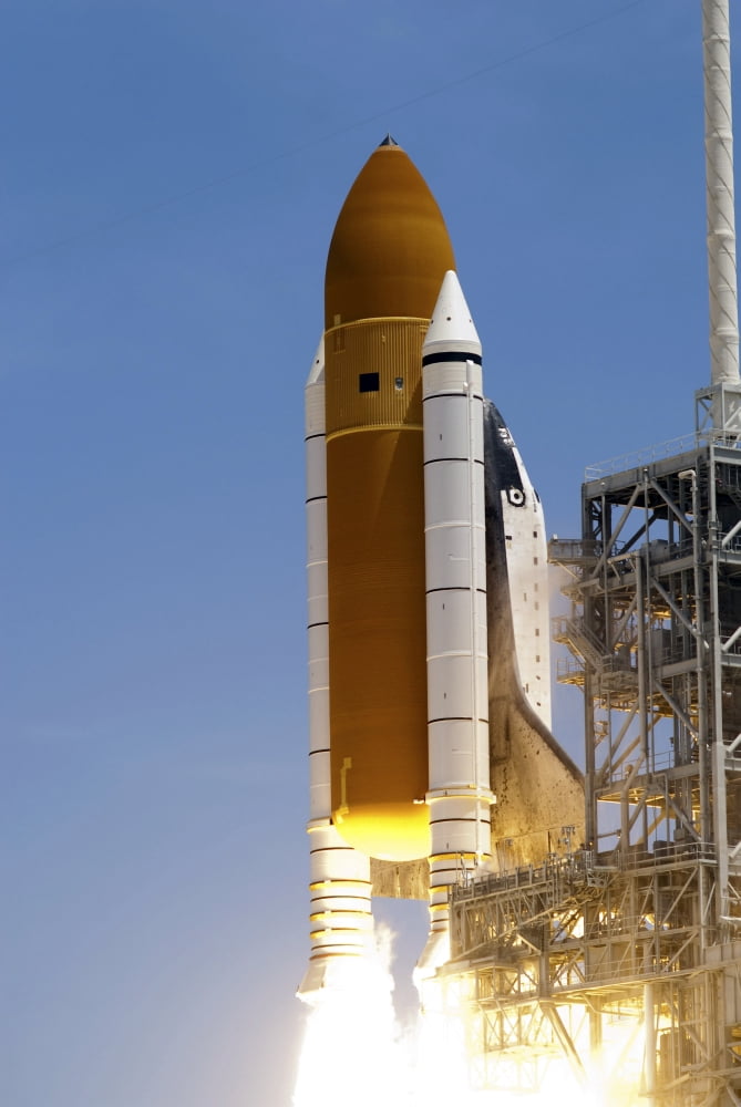 Space shuttle Atlantis twin solid rocket boosters ignite to propel the spacecraft off Kennedy Space Centers Launch Pad 39A Canvas Art - Stocktrek Images (23 x 34)