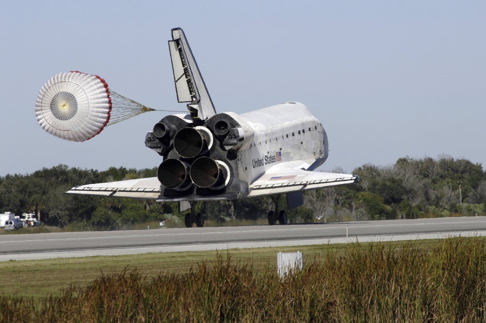 Space shuttle Atlantis unfurls its drag chute upon landing at Kennedy Space Center Florida Canvas Art - Stocktrek Images (35 x 23)