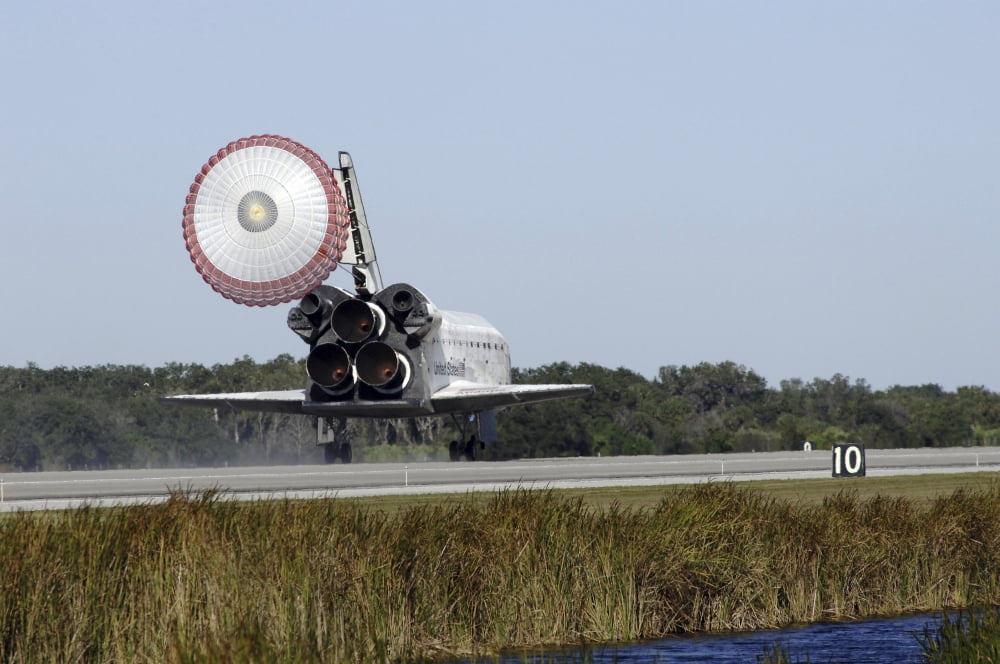 Space shuttle Atlantis unfurls its drag chute upon landing at Kennedy Space Center Florida Canvas Art - Stocktrek Images (35 x 23)