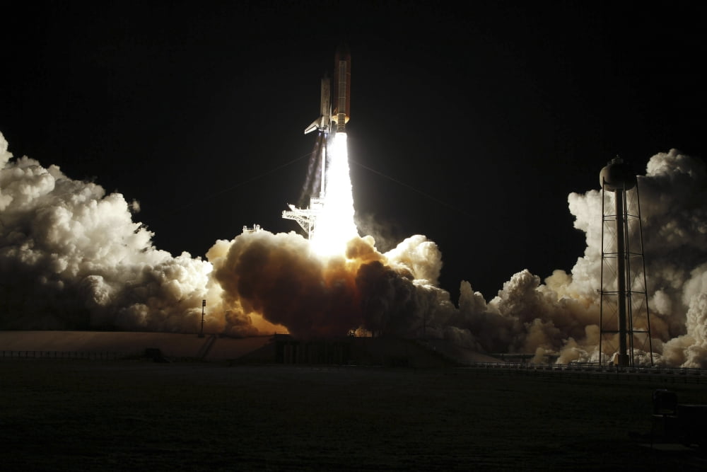 Space shuttle Discovery lifts off from Launch Pad 39A at Kennedy Space Center in Florida on the STS-131 mission Canvas Art - Stocktrek Images (34 x 23)