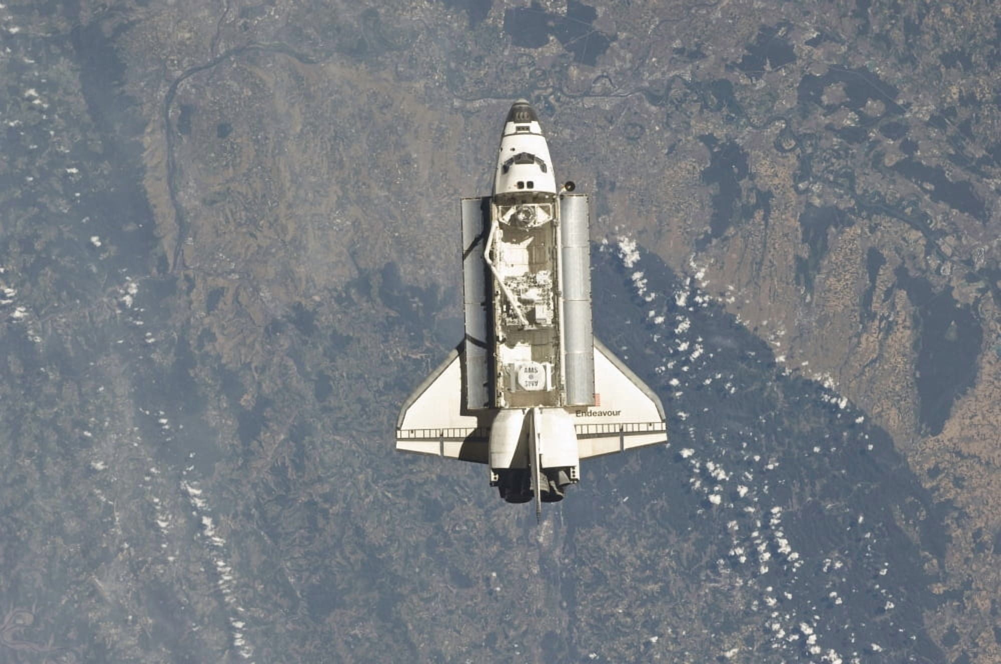 Space shuttle Endeavour backdropped by a colorful Earth Canvas Art - Stocktrek Images (34 x 23)