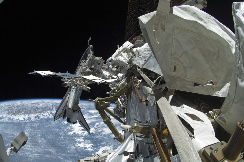 Space shuttle Endeavour docked to the International Space Station Canvas Art - Stocktrek Images (34 x 23)