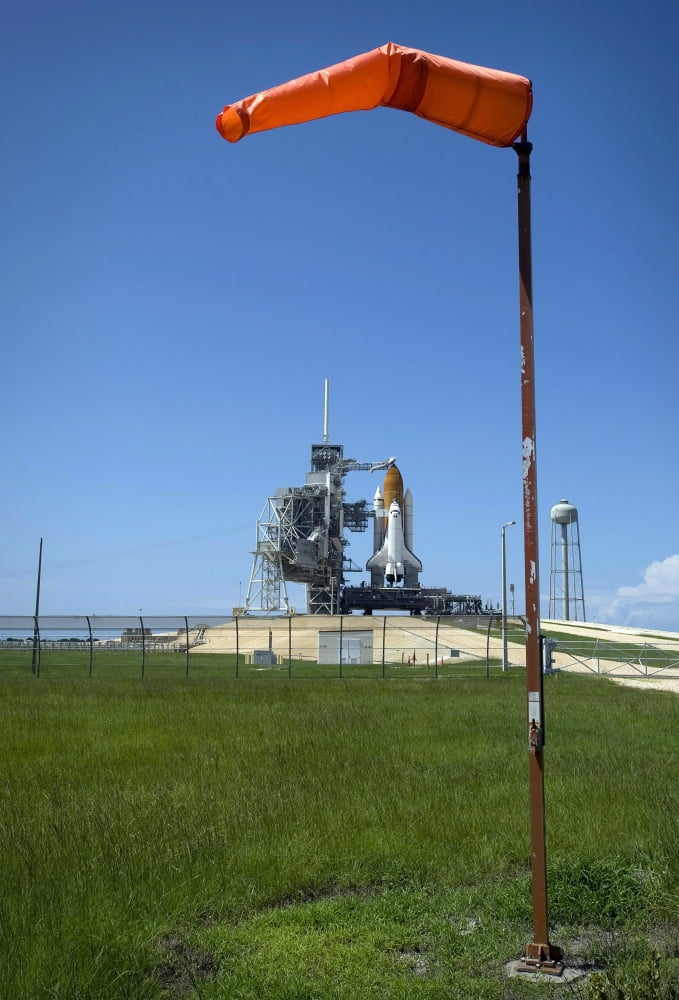 Space shuttle Endeavour is framed by a windsock at the launch pad at Kennedy Space Center Florida Canvas Art - Stocktrek Images (23 x 34)