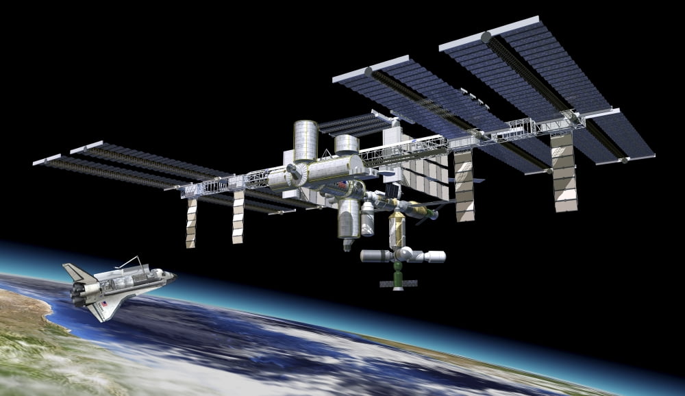 Space station in orbit around Earth with space shuttle Canvas Art - Leonello CalvettiStocktrek Images (37 x 22)