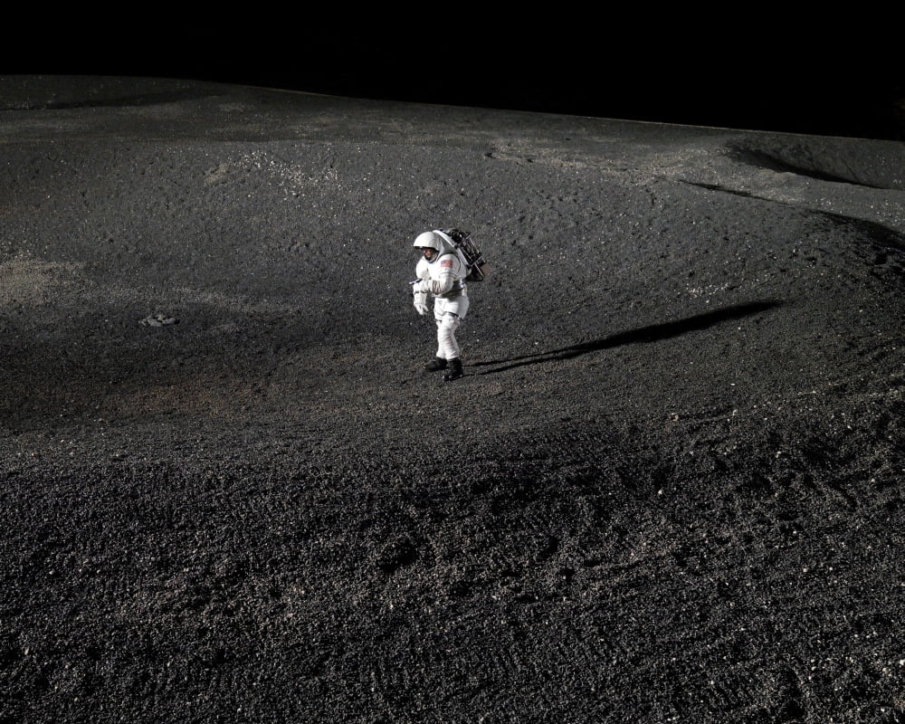 Spacesuit engineer simulates work inside a crater in Johnson Space Centers Lunar Yard Canvas Art - Stocktrek Images (32 x 25)