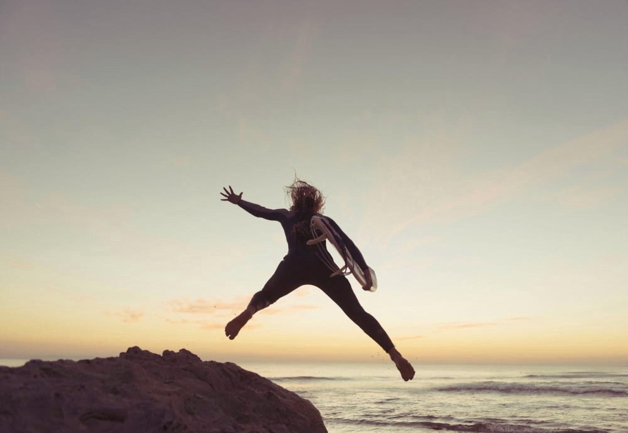 Spain Andalusia Cadiz Costa de la Luz Surfer jumping from rock Tarifa Canvas Art - Ben Welsh Design Pics (36 x 24)
