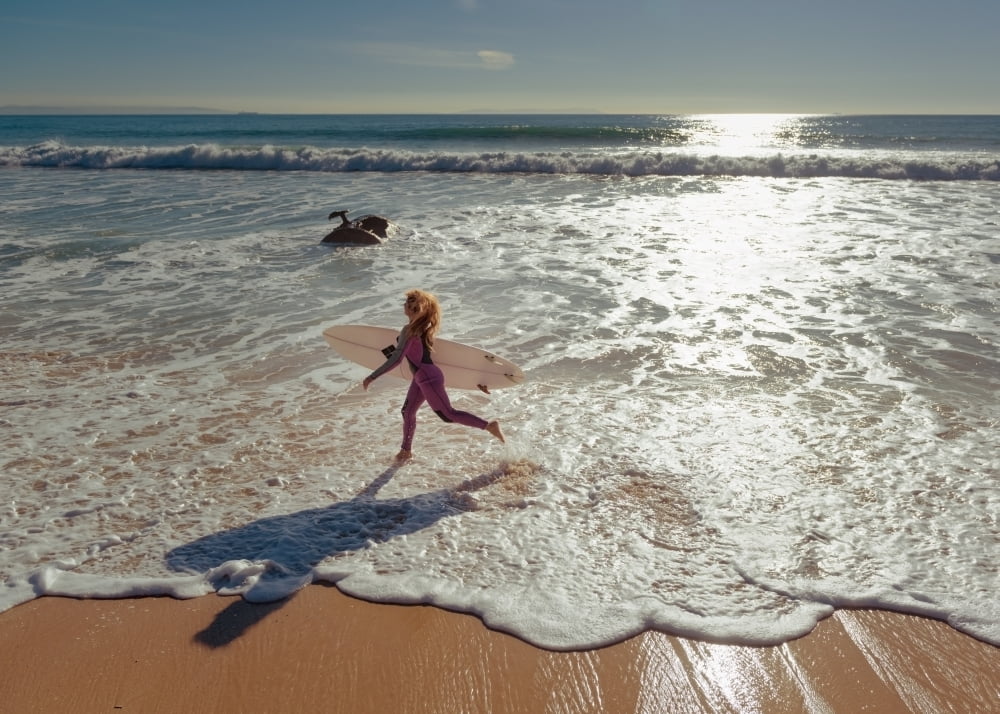 Spain Andalusia Cadiz Costa de la Luz Woman in wetsuit running on beach Tarifa Canvas Art - Ben Welsh Design Pics (18 x 13)