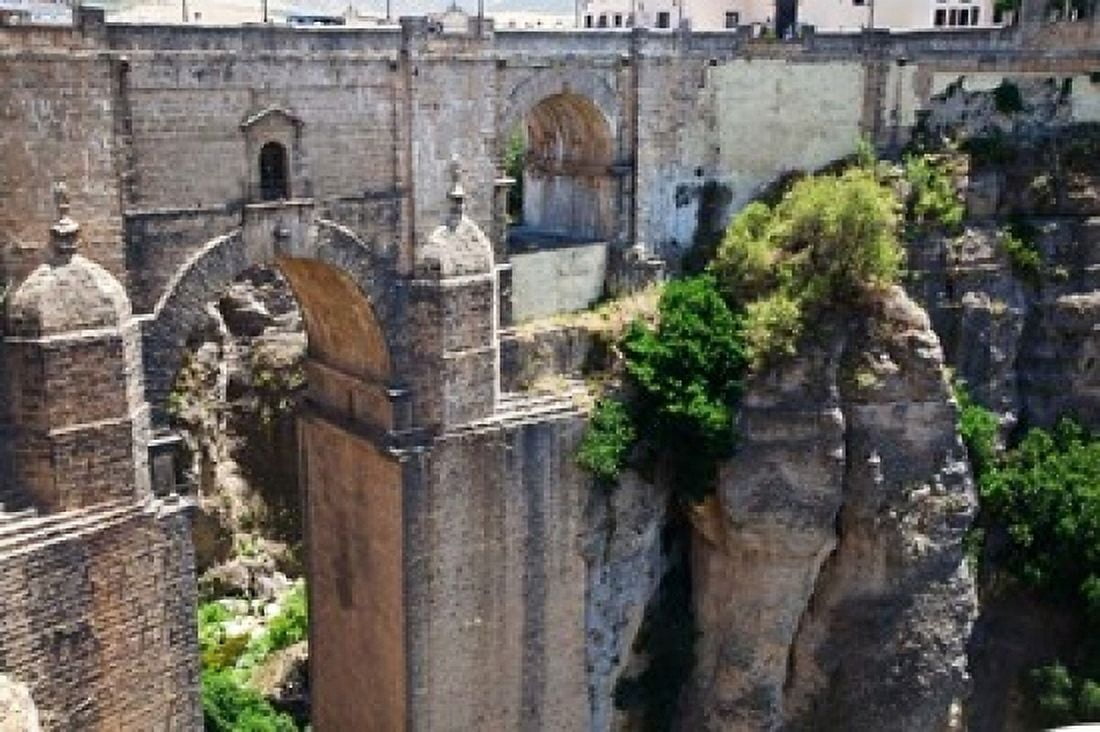 Spain Andalusia Ronda Puente Nuevo bridge above El Tajo gorge Canvas Art - Julie Eggers DanitaDelimont (19 x 12)