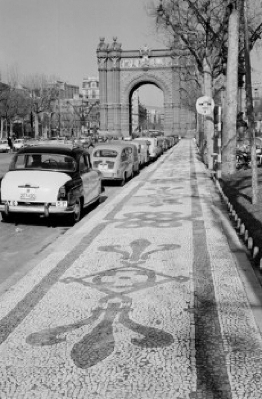 Spain Catalonia Barcelona Row of cars in street near Arc de Triumph Canvas Art - (24 x 36)